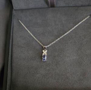 Elegant Blue Topaz And Diamond Pendant